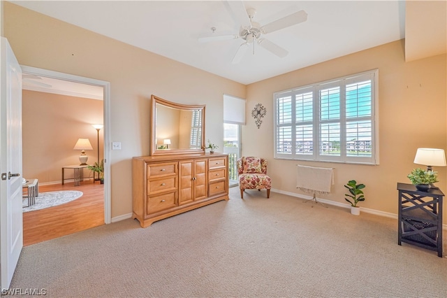 sitting room featuring ceiling fan and light wood-type flooring