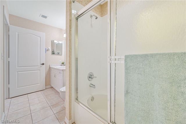 full bathroom with shower / bath combination with glass door, toilet, tile flooring, and vanity