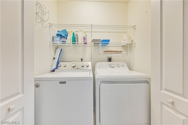 clothes washing area featuring hookup for an electric dryer and separate washer and dryer