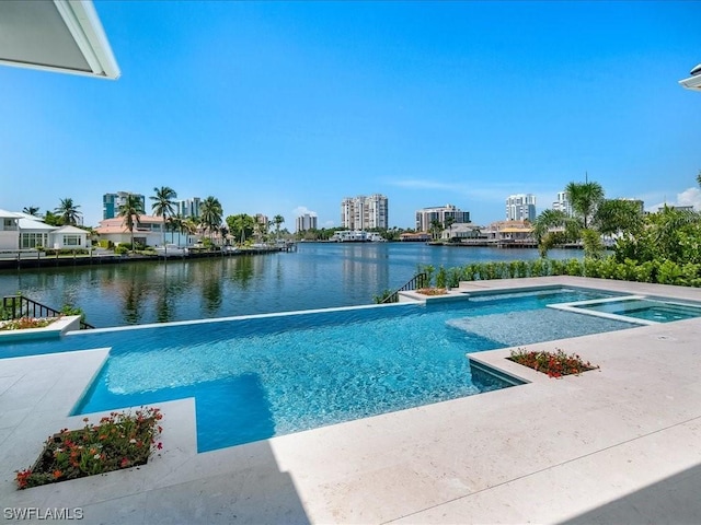 view of pool with a water view