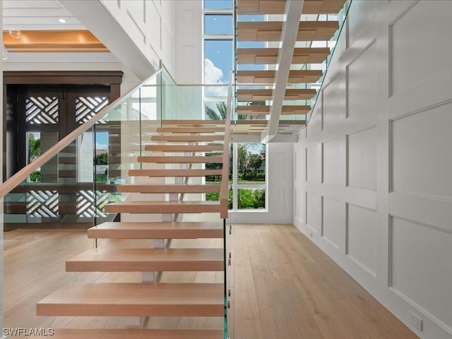 stairs featuring wood-type flooring