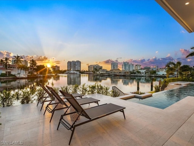 patio terrace at dusk with a water view