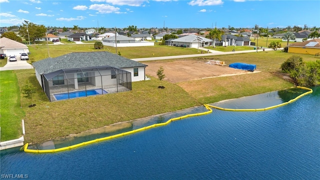 birds eye view of property featuring a residential view and a water view