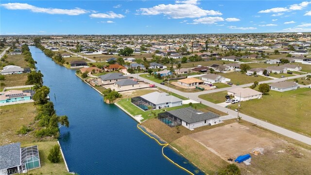 aerial view with a water view and a residential view