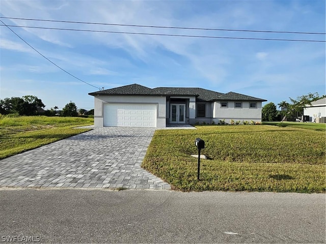 view of front of home featuring decorative driveway, an attached garage, a front lawn, and stucco siding