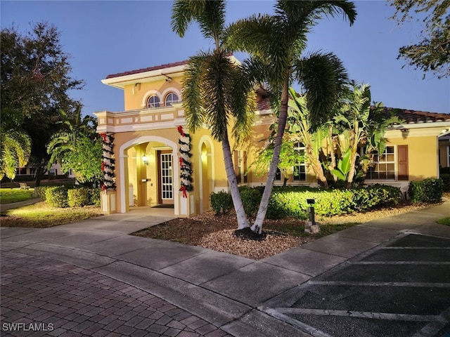 mediterranean / spanish home with a balcony