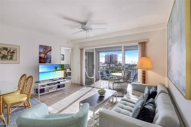 tiled living room with a ceiling fan