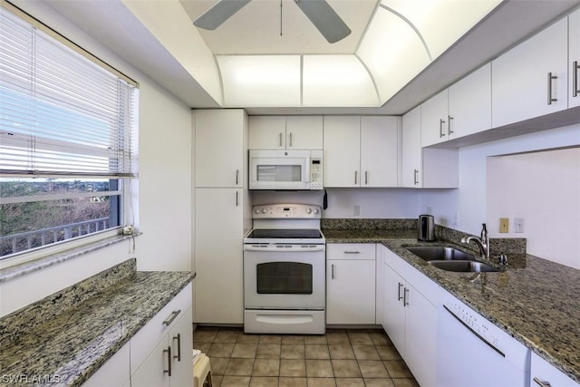 kitchen featuring a ceiling fan, a sink, white appliances, white cabinets, and light tile patterned floors