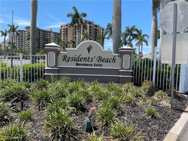 community sign featuring fence