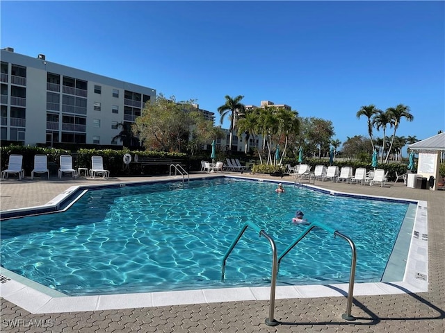 community pool featuring a patio area