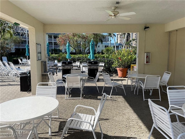 view of patio / terrace with outdoor dining area and ceiling fan