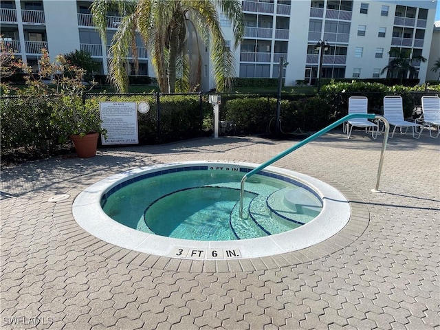 view of pool featuring a hot tub