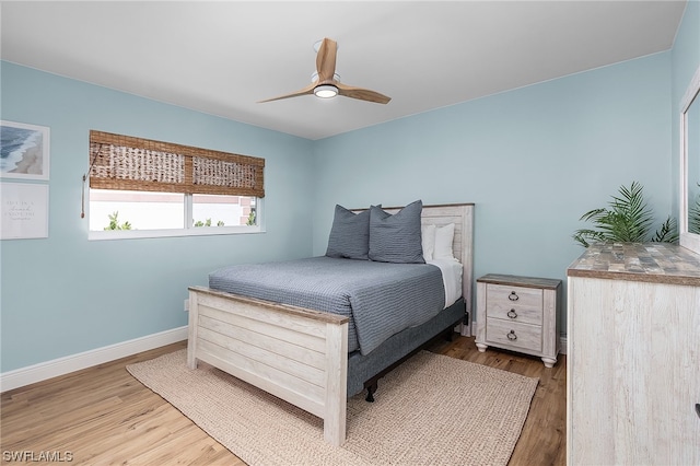 bedroom featuring hardwood / wood-style floors and ceiling fan