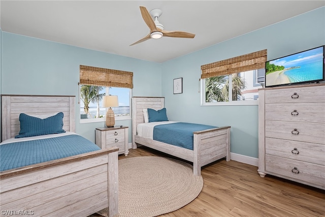 bedroom featuring ceiling fan and light wood-type flooring