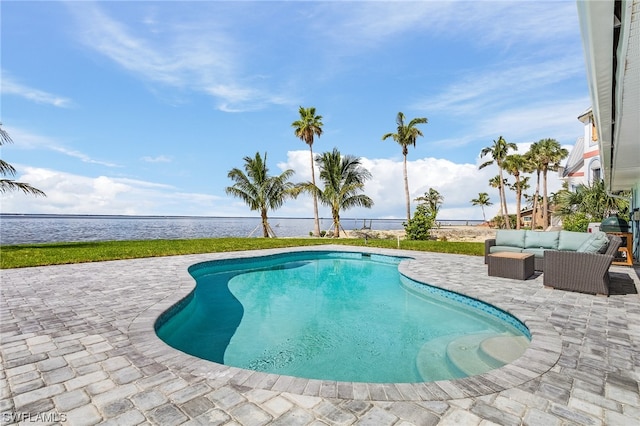 view of pool featuring an outdoor hangout area, a patio, and a water view