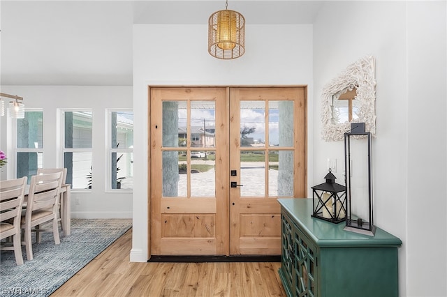 doorway with light wood-type flooring