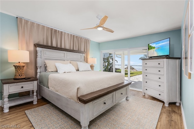 bedroom with access to outside, ceiling fan, and light wood-type flooring