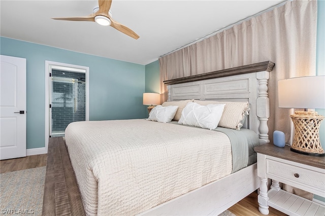 bedroom with ensuite bathroom, ceiling fan, and wood-type flooring