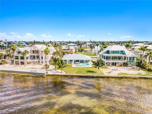 birds eye view of property featuring a water view