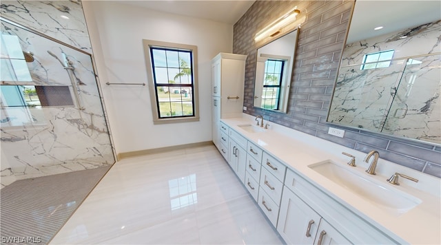 bathroom with double sink vanity, tile walls, tile floors, and a shower with shower door