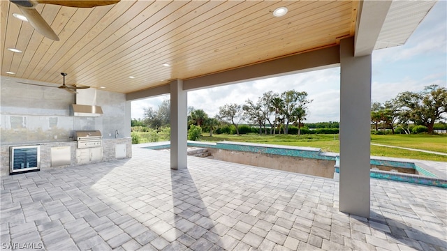 view of patio / terrace featuring area for grilling, grilling area, and ceiling fan