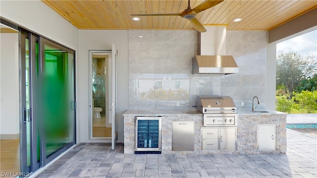 view of patio with area for grilling, grilling area, ceiling fan, and sink