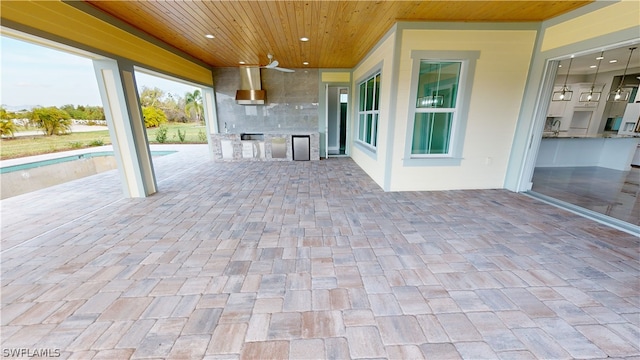 view of patio / terrace featuring an outdoor kitchen and ceiling fan