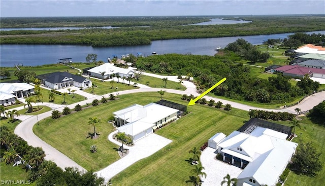 birds eye view of property with a water view