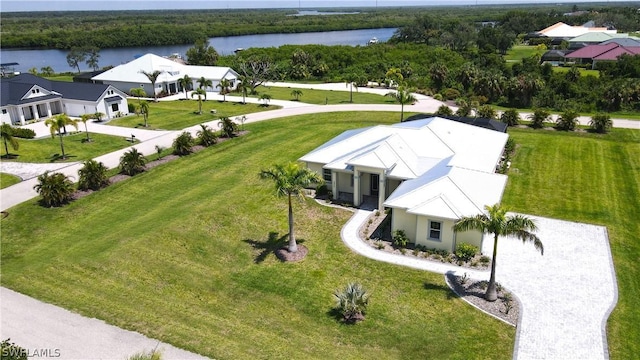 birds eye view of property featuring a water view