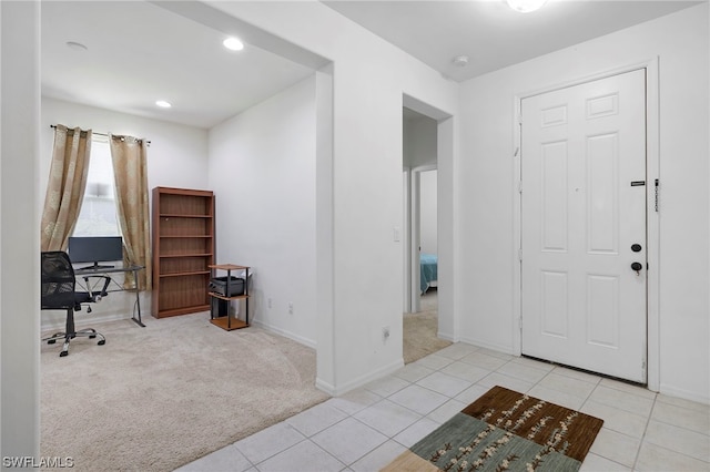 entrance foyer with light colored carpet