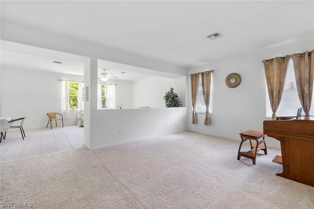 sitting room with light carpet and ceiling fan