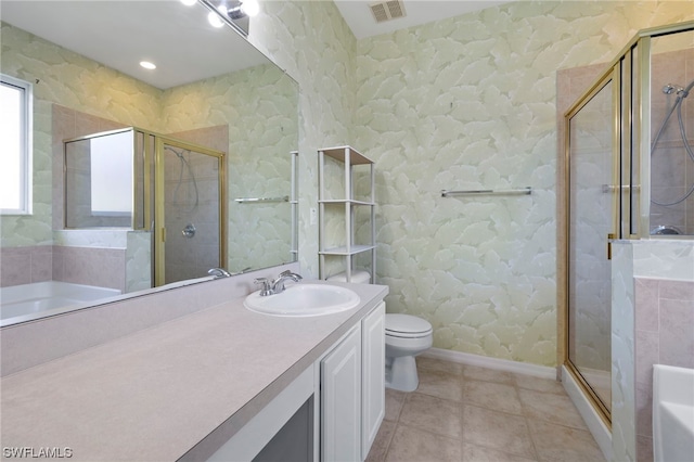 full bathroom with toilet, separate shower and tub, large vanity, and tile flooring