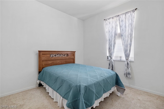 bedroom with light colored carpet