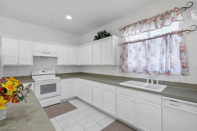 kitchen with light tile floors, white appliances, white cabinetry, and sink