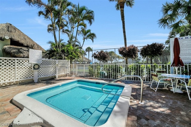 view of swimming pool featuring a patio area