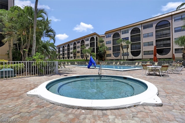 view of swimming pool with a patio