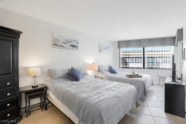 bedroom featuring light tile floors