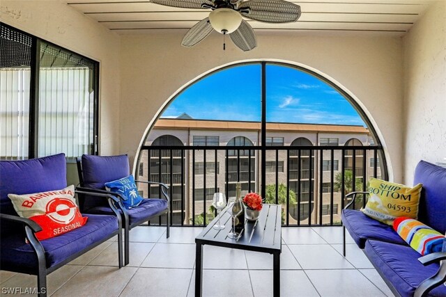 sunroom featuring ceiling fan