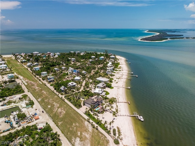 aerial view featuring a water view and a view of the beach