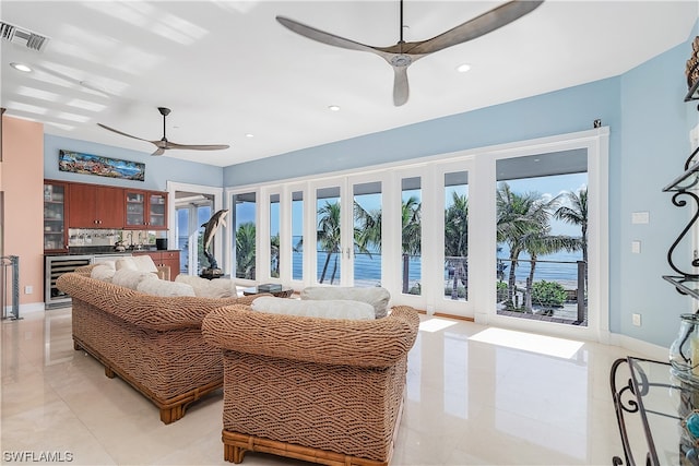 living room featuring beverage cooler and ceiling fan