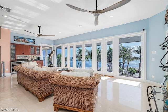 211 Kingfisher Dr, Captiva, FL 33924 - living area with baseboards, recessed lighting, a ceiling fan, visible vents, and wine cooler
