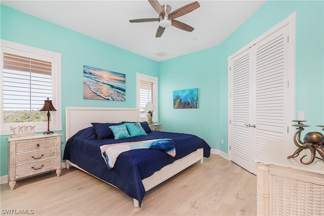 bedroom featuring a closet, ceiling fan, and light hardwood / wood-style floors