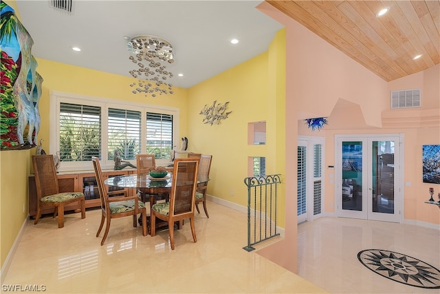 dining space with high vaulted ceiling, wooden ceiling, and french doors