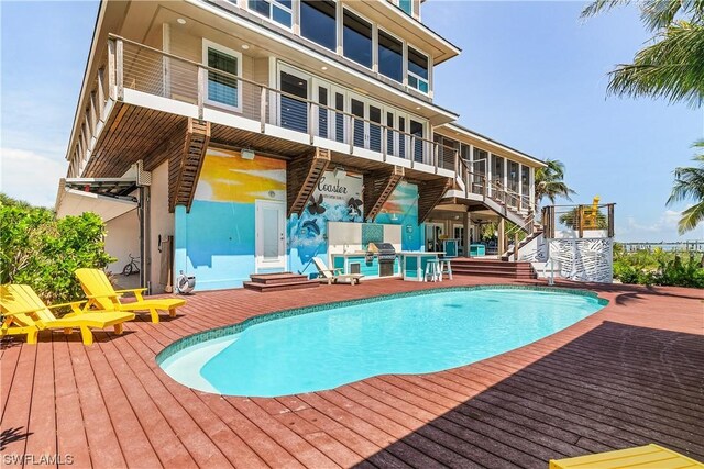 211 Kingfisher Dr, Captiva, FL 33924 - pool featuring grilling area, stairway, and a patio