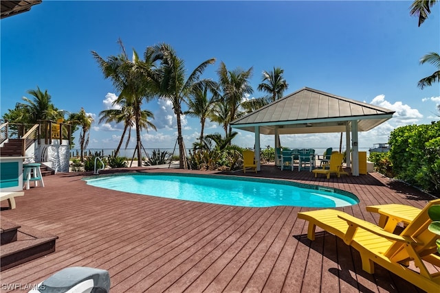 view of swimming pool with a wooden deck and a gazebo