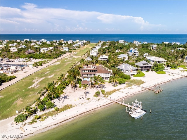 drone / aerial view featuring a view of the beach and a water view