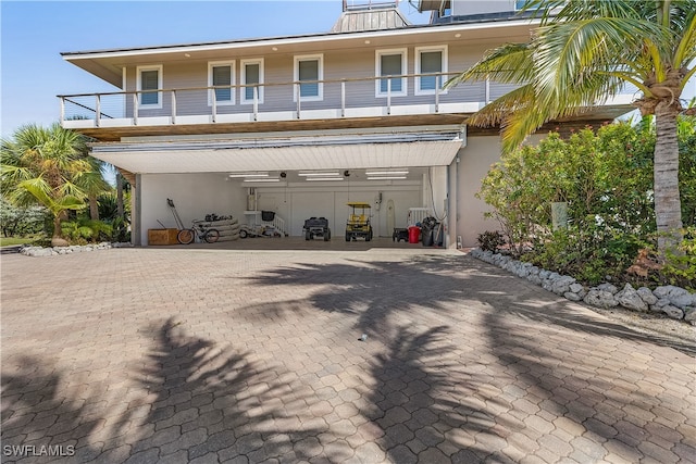 rear view of house featuring a balcony