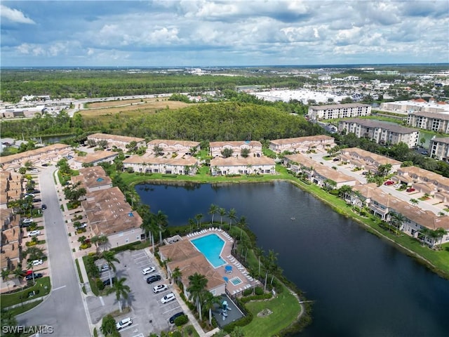 birds eye view of property with a water view