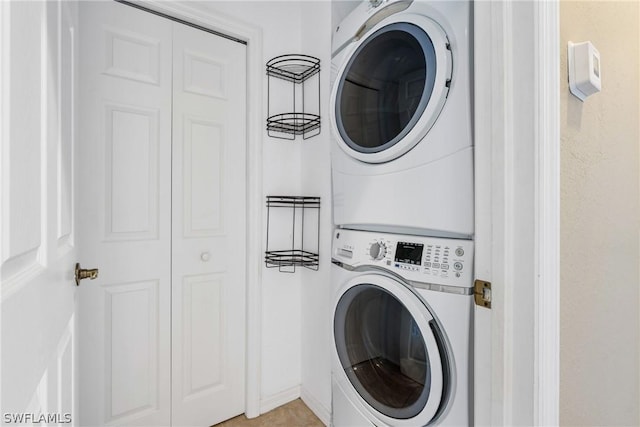 laundry area with stacked washing maching and dryer