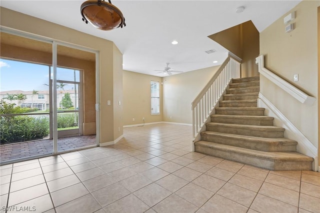 interior space featuring ceiling fan and tile patterned floors